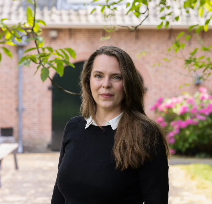 Myrthe Trompert of Salvius Legal standing in the garden at Salvius